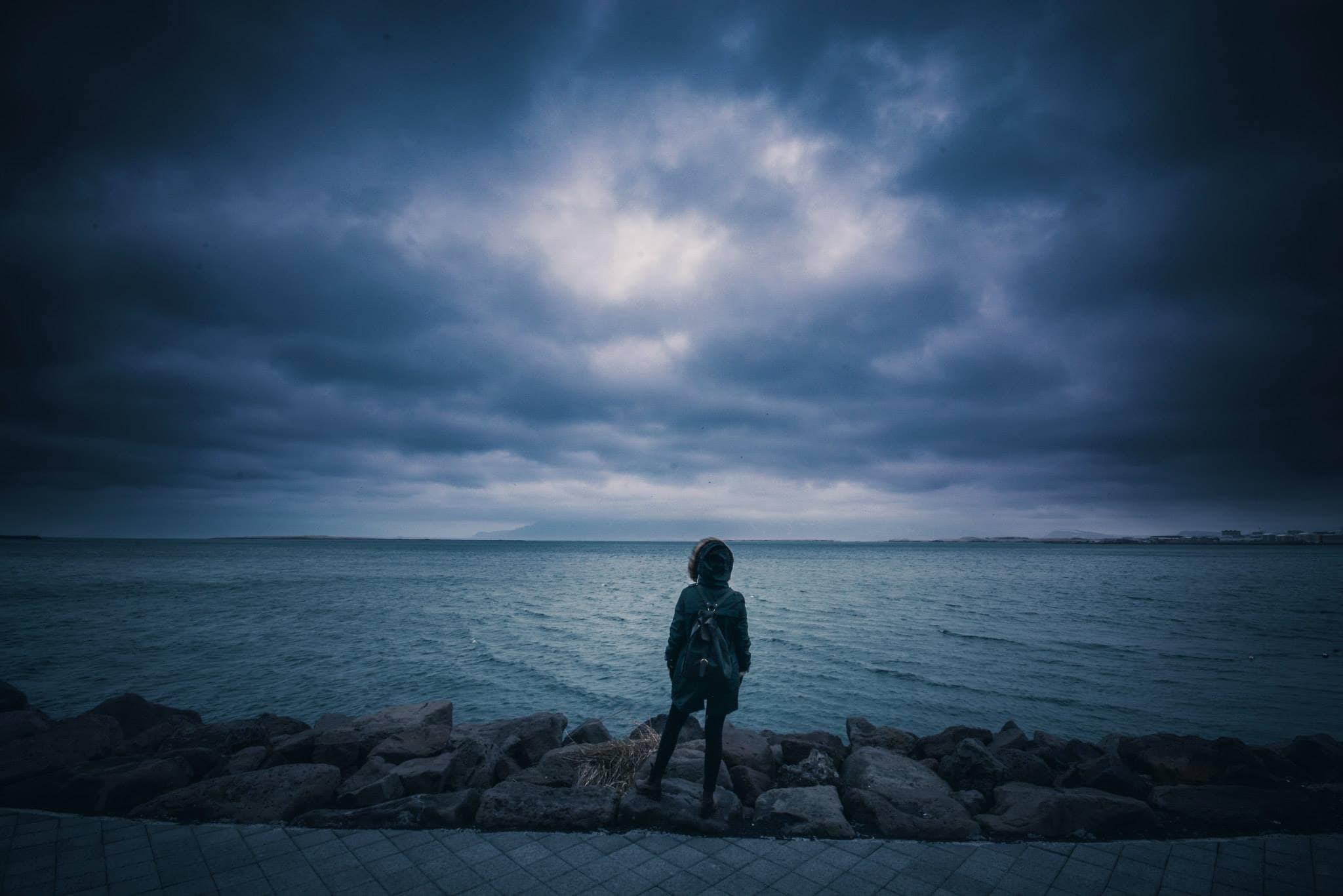 A man with depression looking out over the water